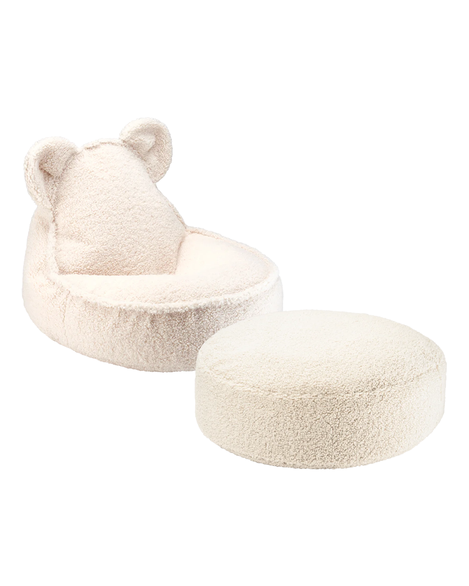 Blush pink bear-shaped beanbag chair with matching round ottoman on plain background