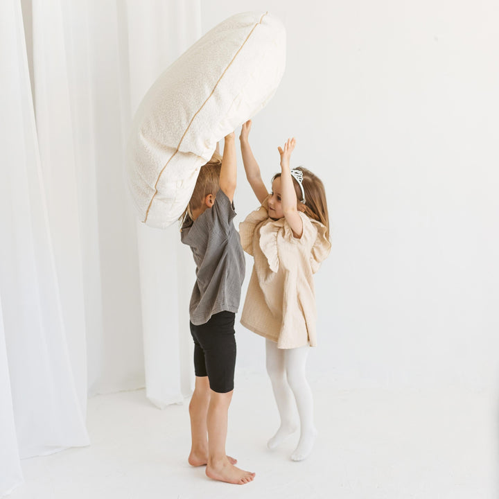 MINICAMP ecru boucle floor cushion, side view