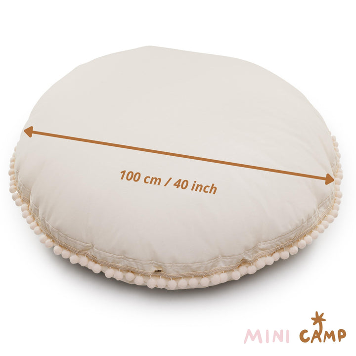 MINICAMP ecru pom pom floor cushion, side view