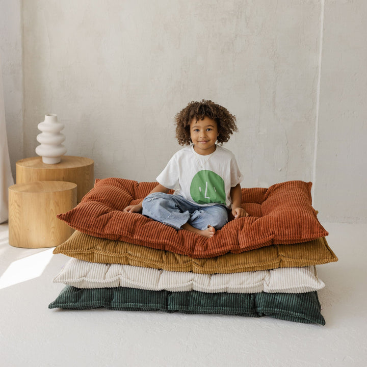 MINICAMP terracotta tufted floor cushion, close product view