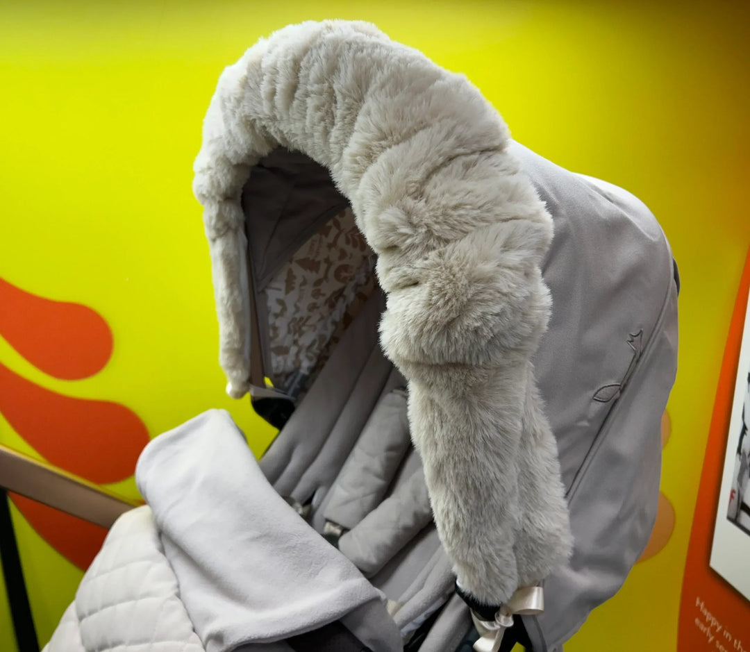 Roma Pram Hood Fur in feather colourway, fitted to a pushchair hood