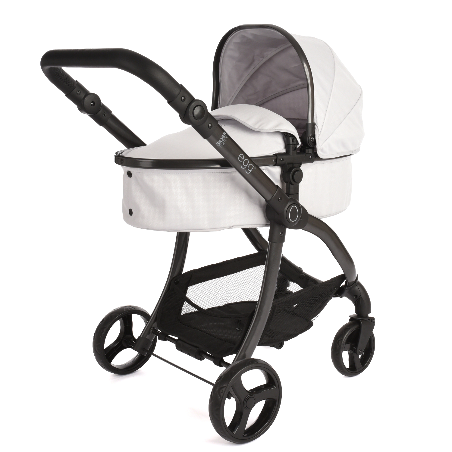 Roma Egg® Dolls Pram in Houndstooth Silver, three-quarter view showing the titanium matte chassis and houndstooth print carrycot