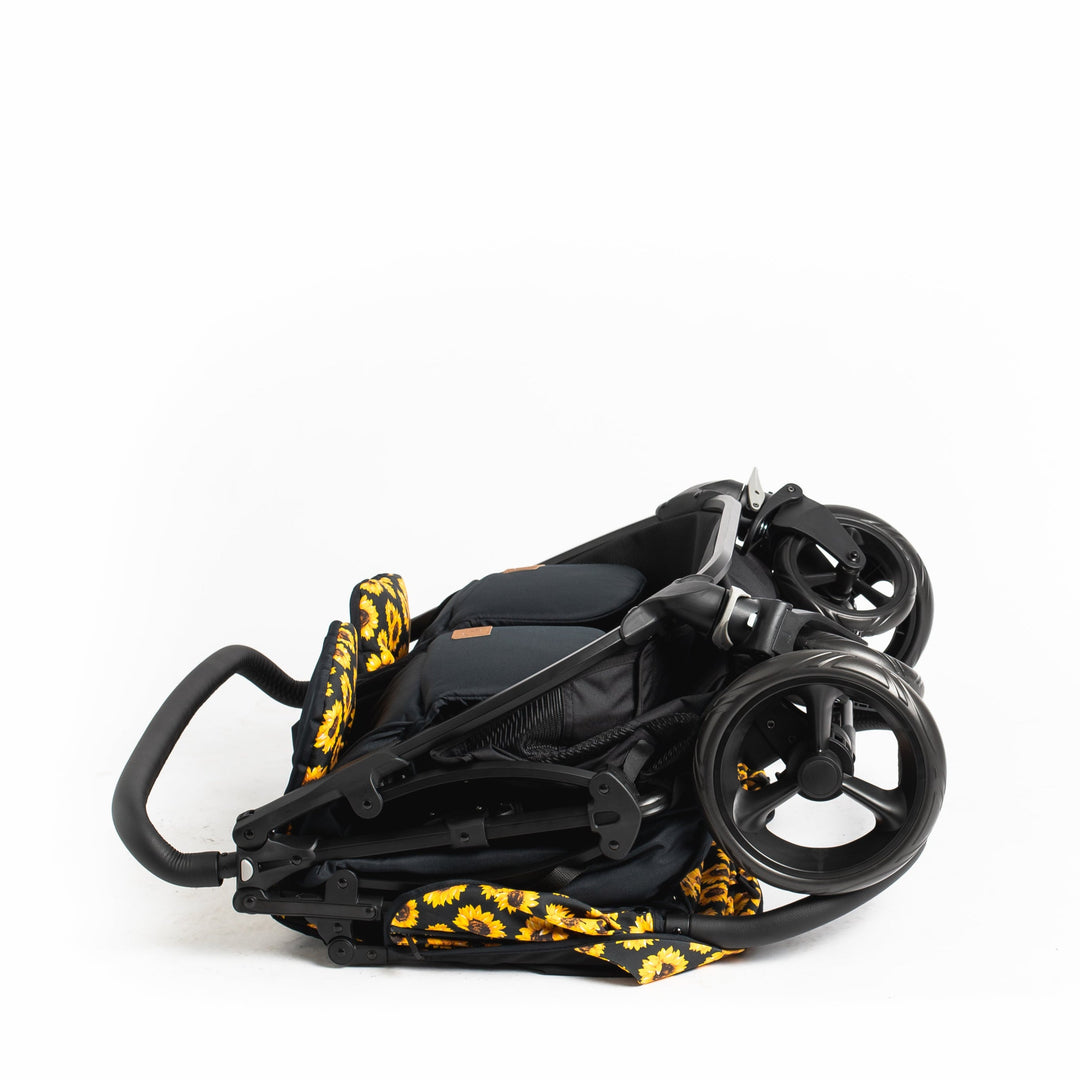 Roma Gemini 2 double pushchair in Sunflower, folded standing
