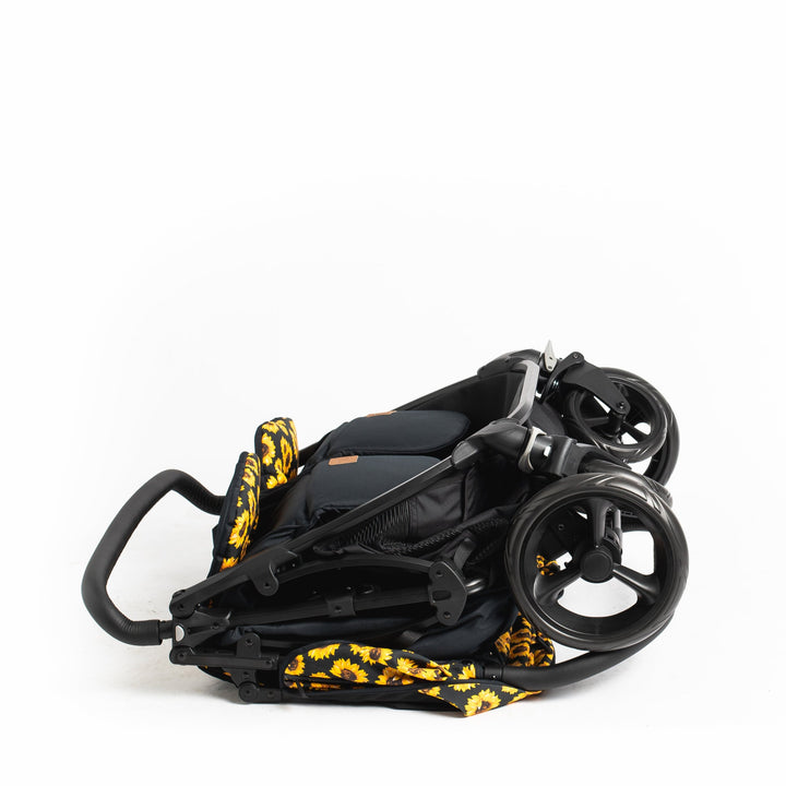 Roma Gemini 2 double pushchair in Sunflower, folded standing