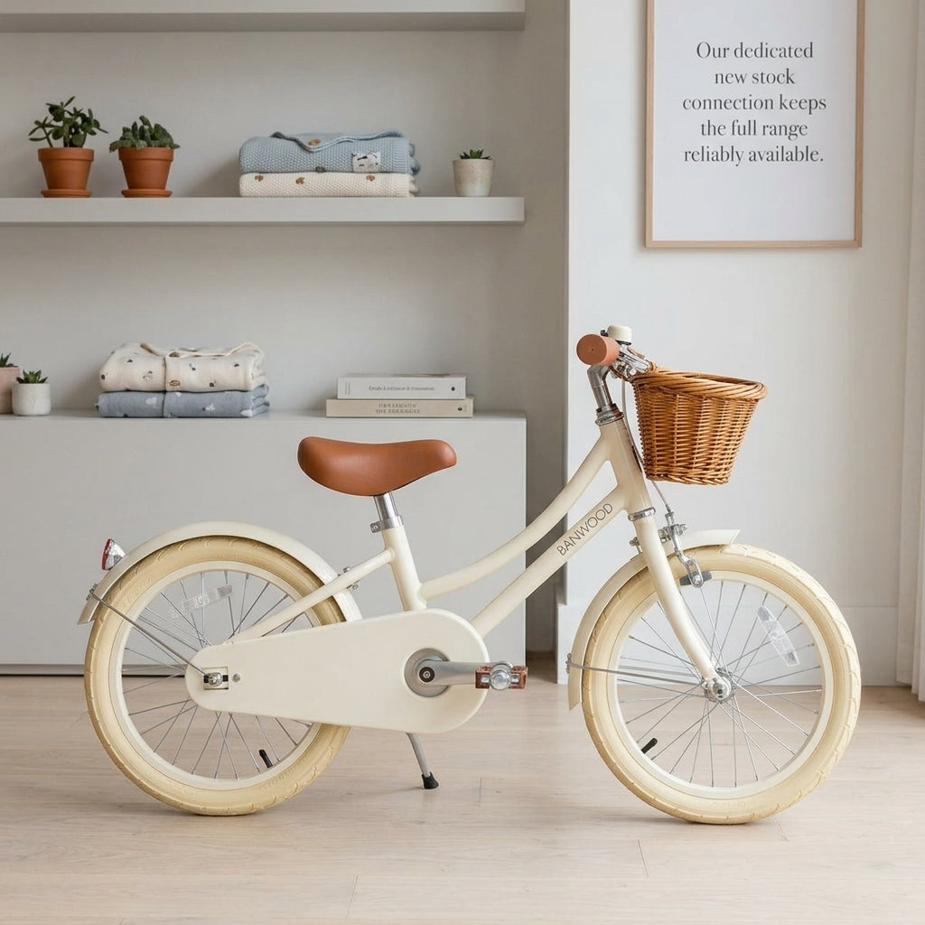 Banwood Classic Bicycle in Cream shown in a bright, tidy setting