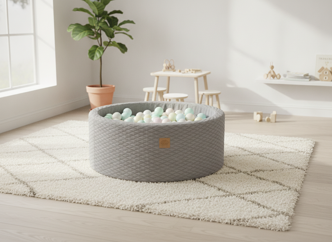 MeowBaby Stone Grey round foam ball pit on a light rug in a bright playroom