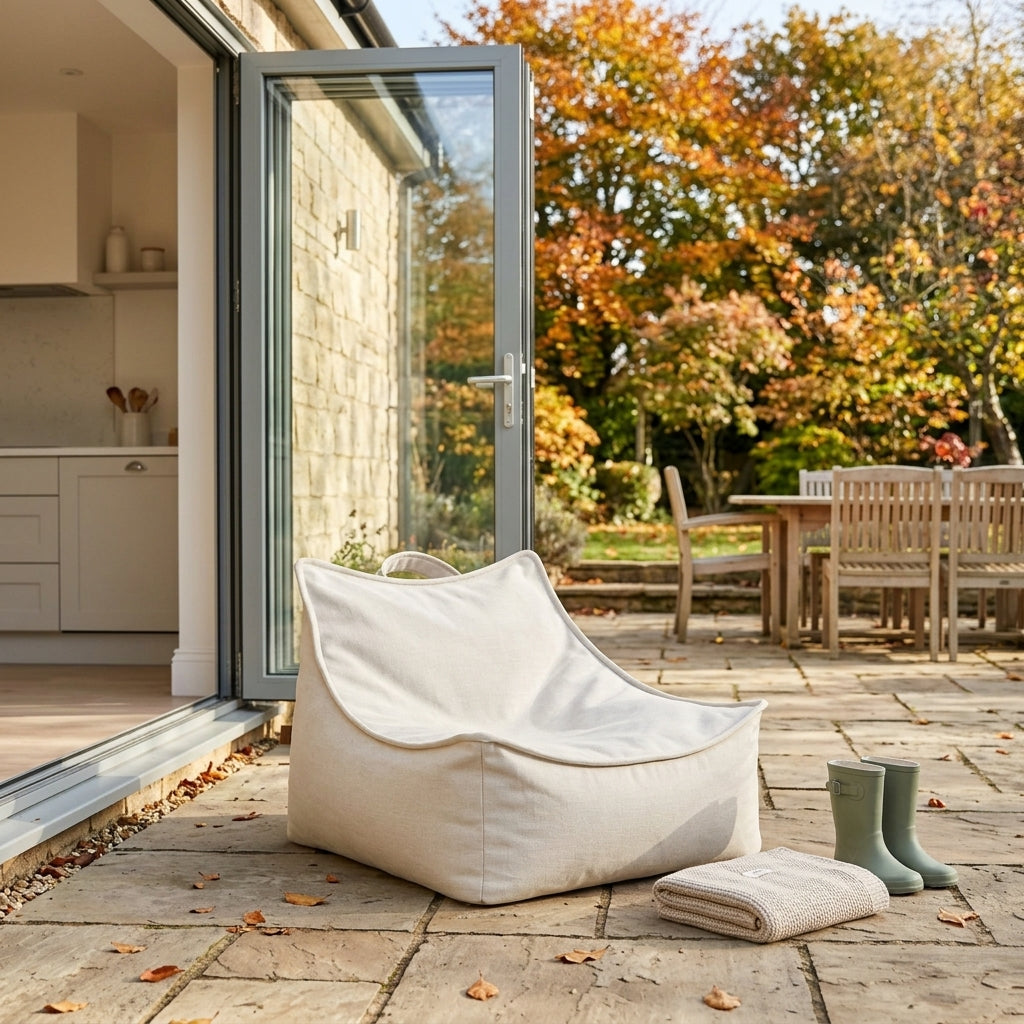 Oat beige outdoor children's bean bag on a dry patio by open garden doors