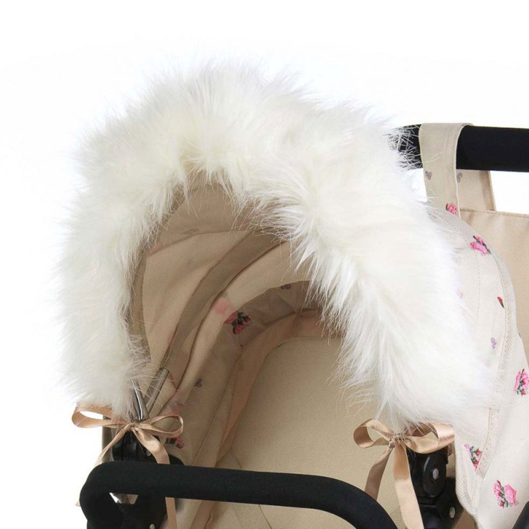 Roma Dolls Pram Hood Fur in cream, ribbon-tied to a dolls pram hood
