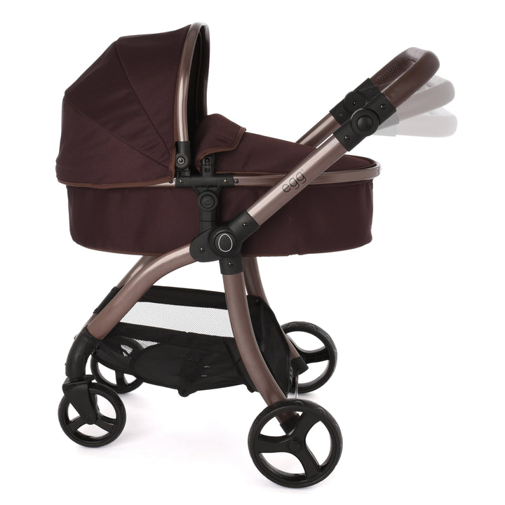 Roma Egg® Dolls Pram in Mulberry, close view of the carrycot hood and Mulberry fabric