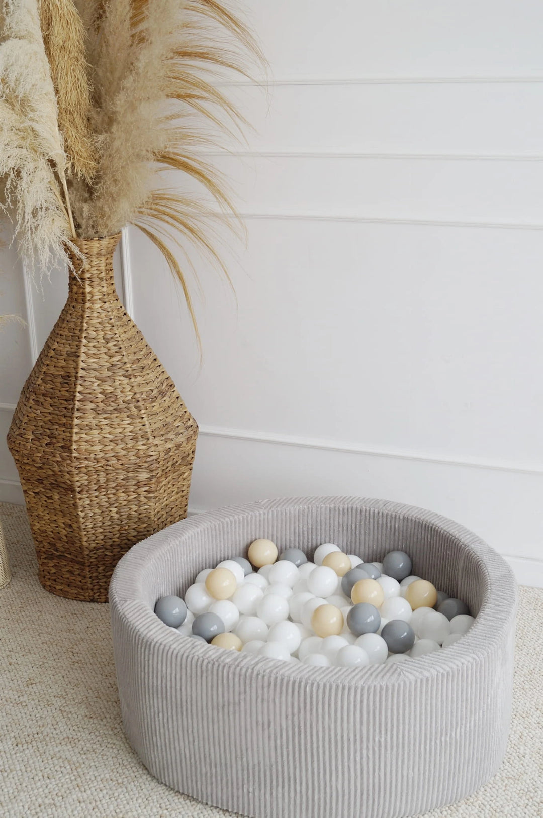 Monio for Kids Grey Corduroy Round Ball Pit — baby playing in grey corduroy ball pit