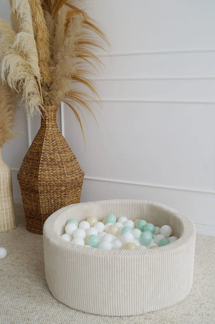Monio for Kids Cream Corduroy Round Ball Pit — lifestyle image showing play depth