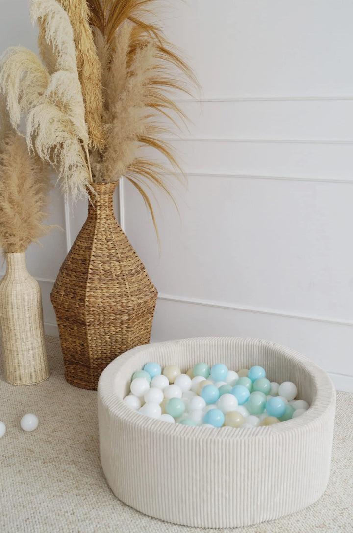 Monio for Kids Cream Corduroy Round Ball Pit — lifestyle image showing ball pit in use