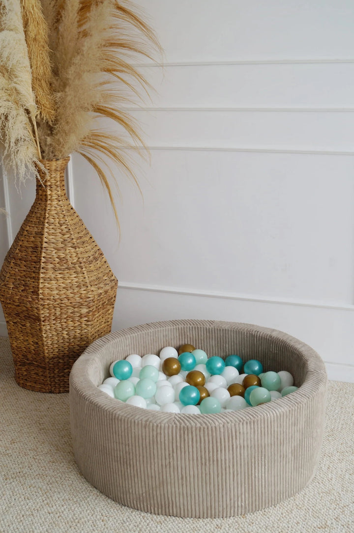 Monio for Kids Beige Corduroy Round Ball Pit — lifestyle image with child in play setting