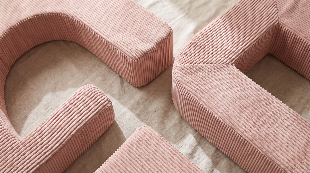 Close-up of the MeowBaby Aesthetic Play Arch's ribbed corduroy texture