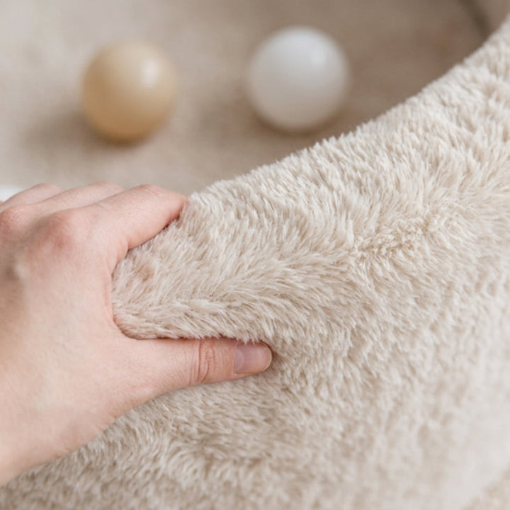 Close-up of the soft plush fabric texture on the Monio for Kids Ecru Plush Round Ball Pit