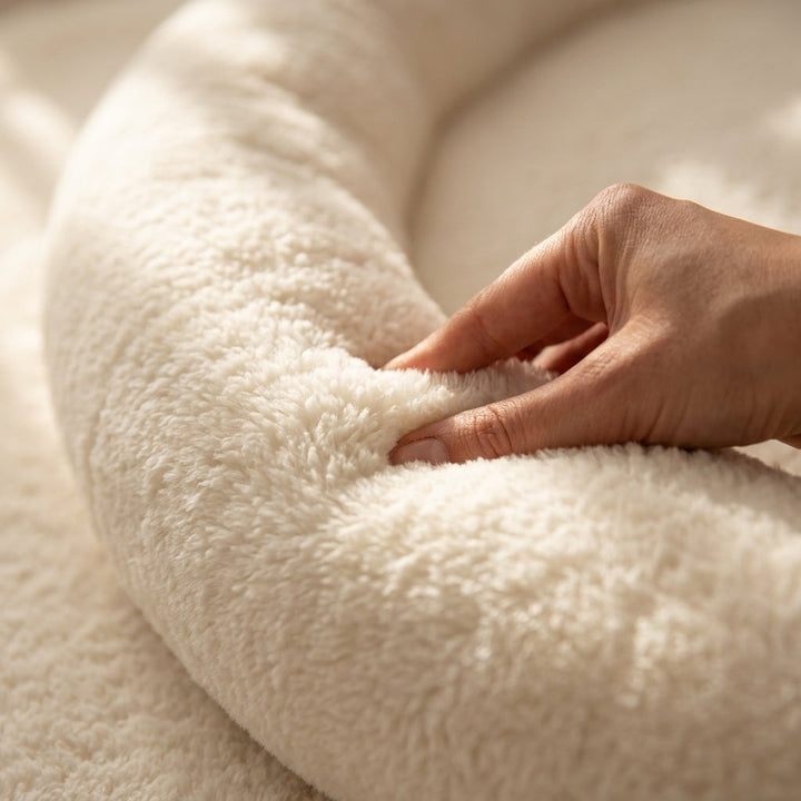 Close-up of the soft plush fabric texture on the Monio for Kids Ecru Plush Padded Nest Playmat