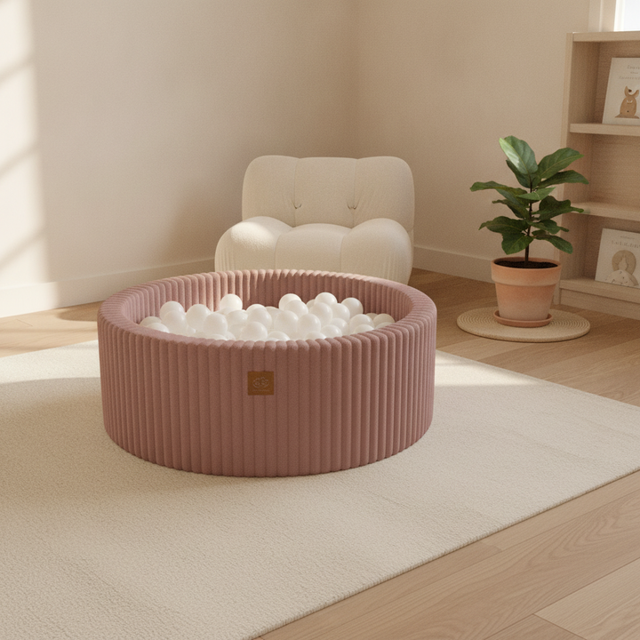 MeowBaby Ruby Chocolate Pink Churros round ball pit in a Scandi nursery corner
