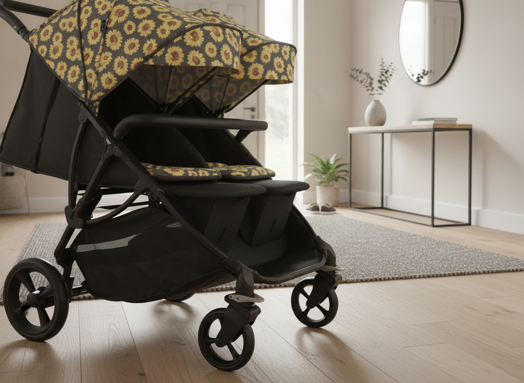 Roma Gemini 2 pushchair chassis base unit showing the wheels and frame in a home entryway