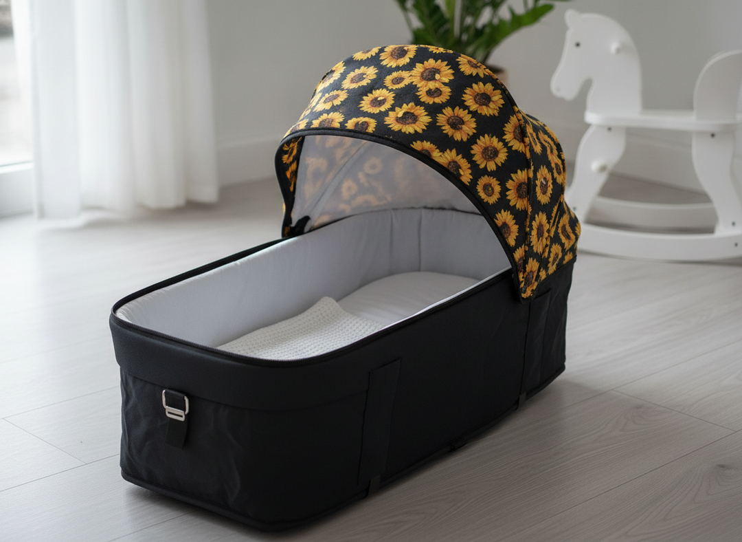 Roma Gemini 2 Carry Cot in Sunflower showing the extendable hood and cushioned interior