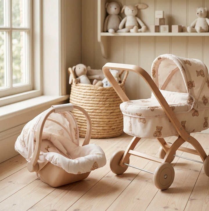 Roma Teddy Dolls Car Seat beside the matching Roma Teddy dolls pram in a nursery playroom