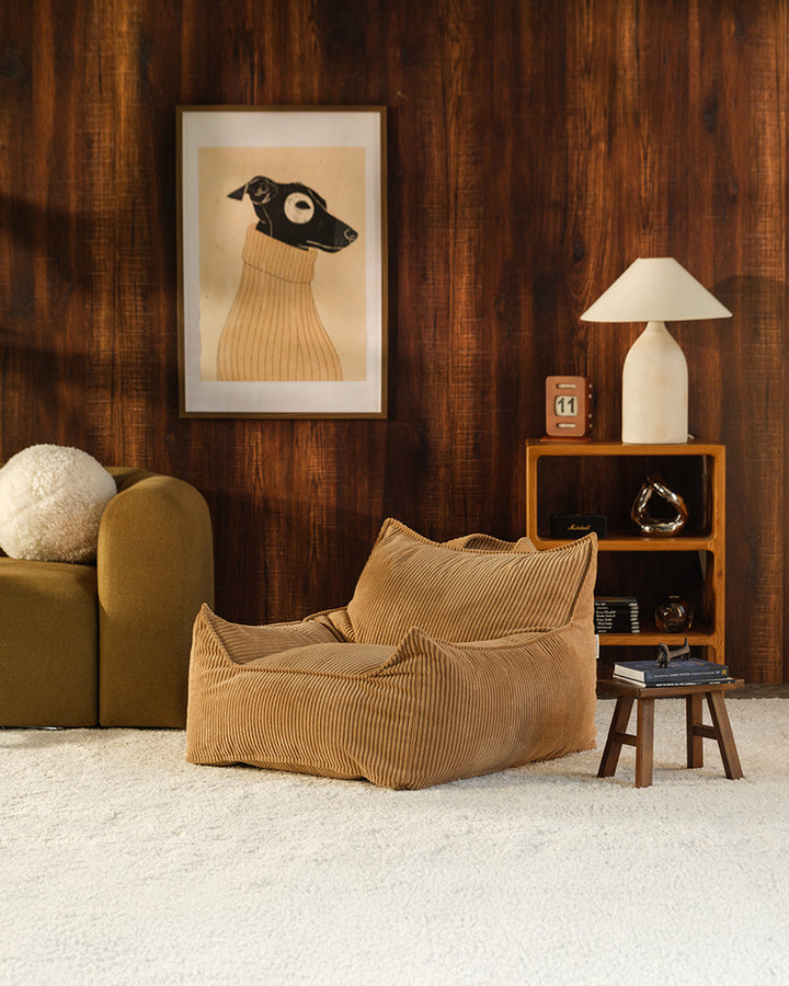Toffee Wigiwama Club Chair styled in a warm-toned living room setting