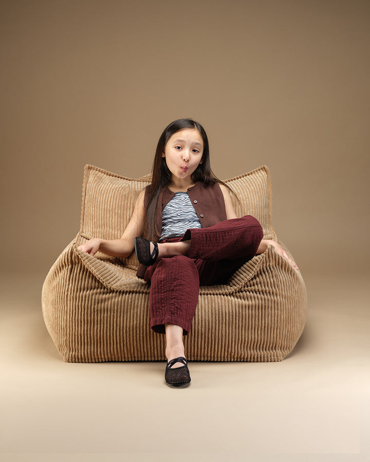 Toffee Wigiwama Club Chair, side profile view showing carry handle
